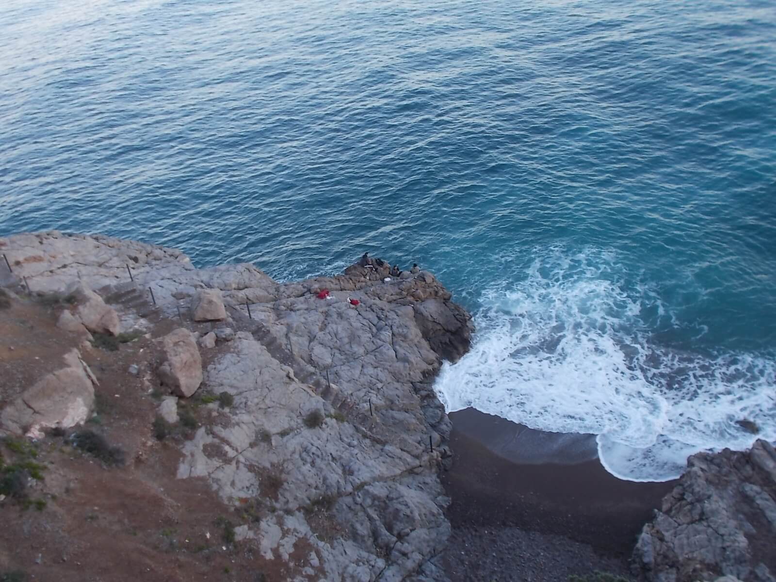 cliff-wave-fishermen